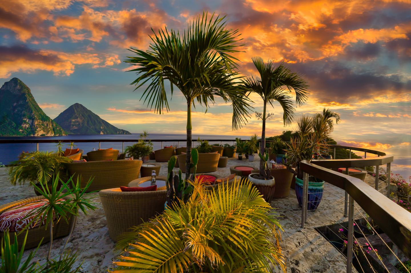 An open-wall Jade Mountain sanctuary at sunset, facing the Pitons.